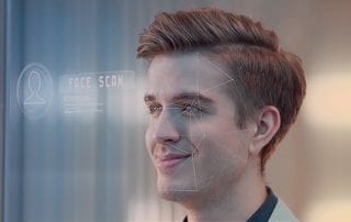 Facial recognition software scans a young mans smiling face