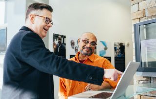 tips for business man pointing at computer